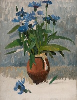 Still life with blue stocks in an...