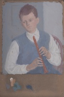 Young boy playing a recorder
