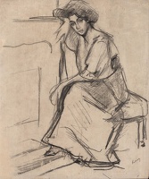 Model seated in front of a fireplace